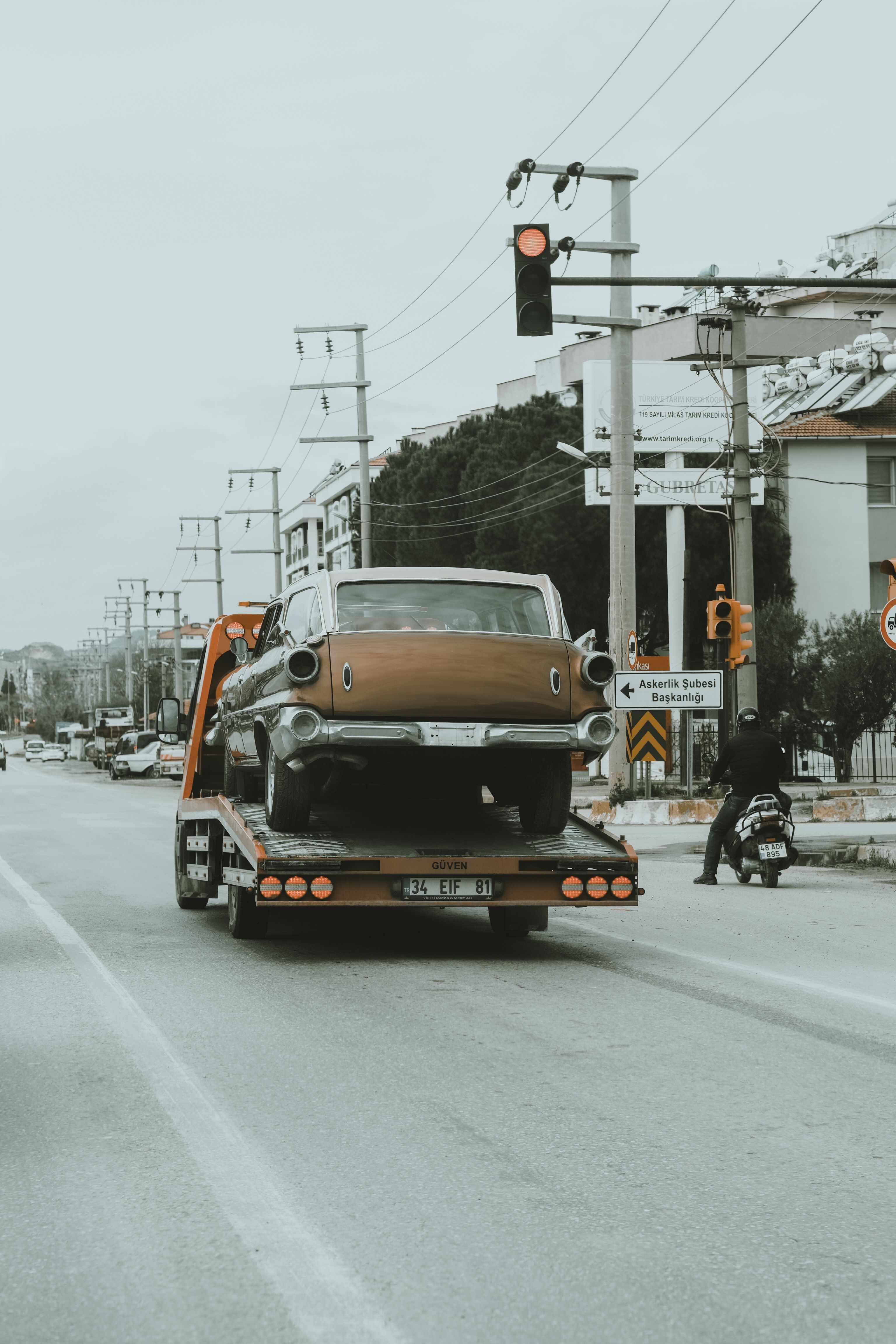Luxury car on flatbed tow truck