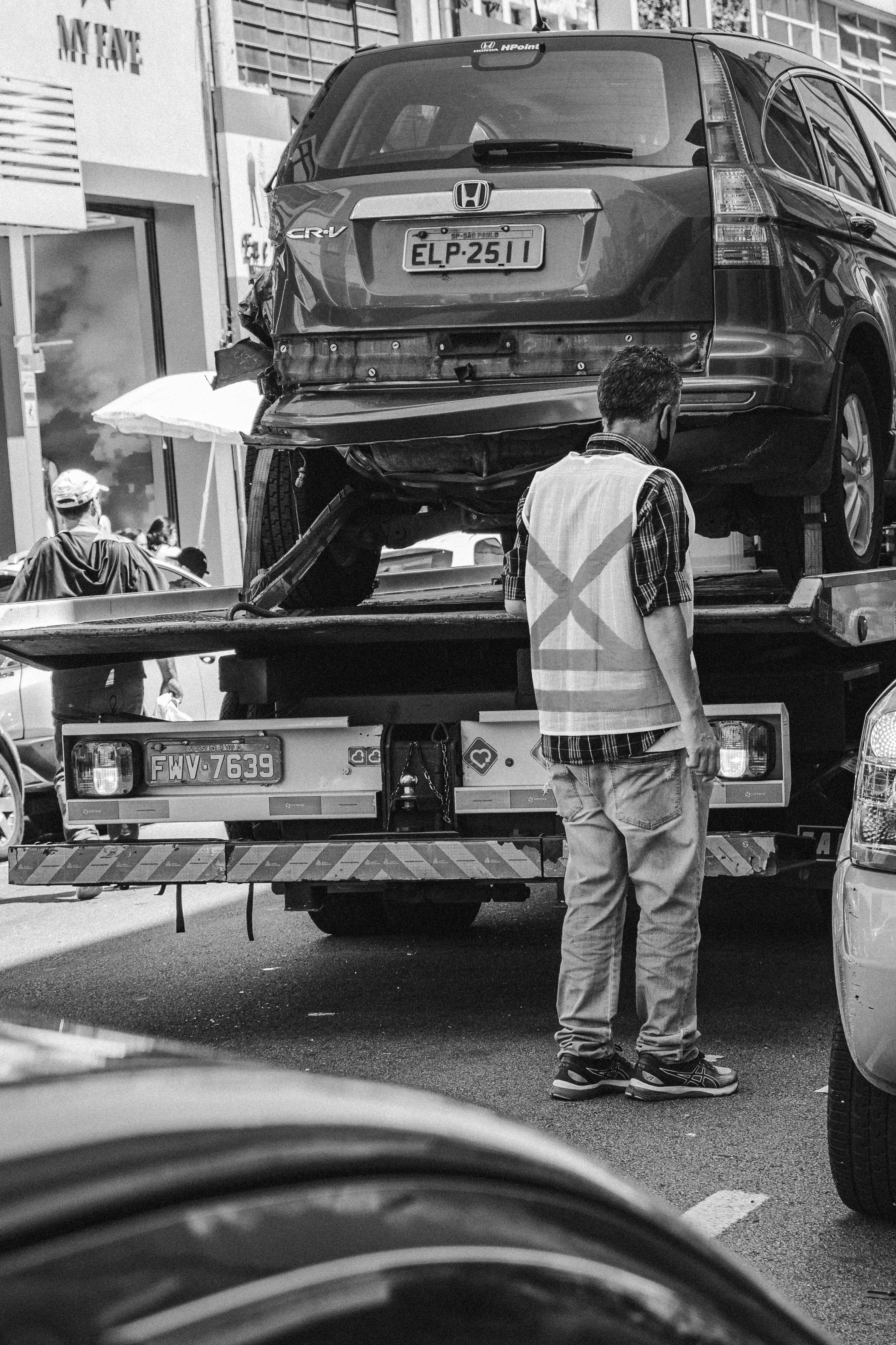 Roadside assistance technician helping driver